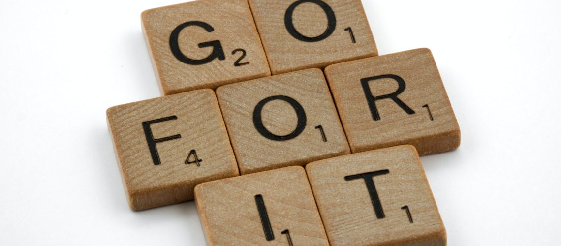 "Go For It" is spelled out in scrabble letters against a white background.